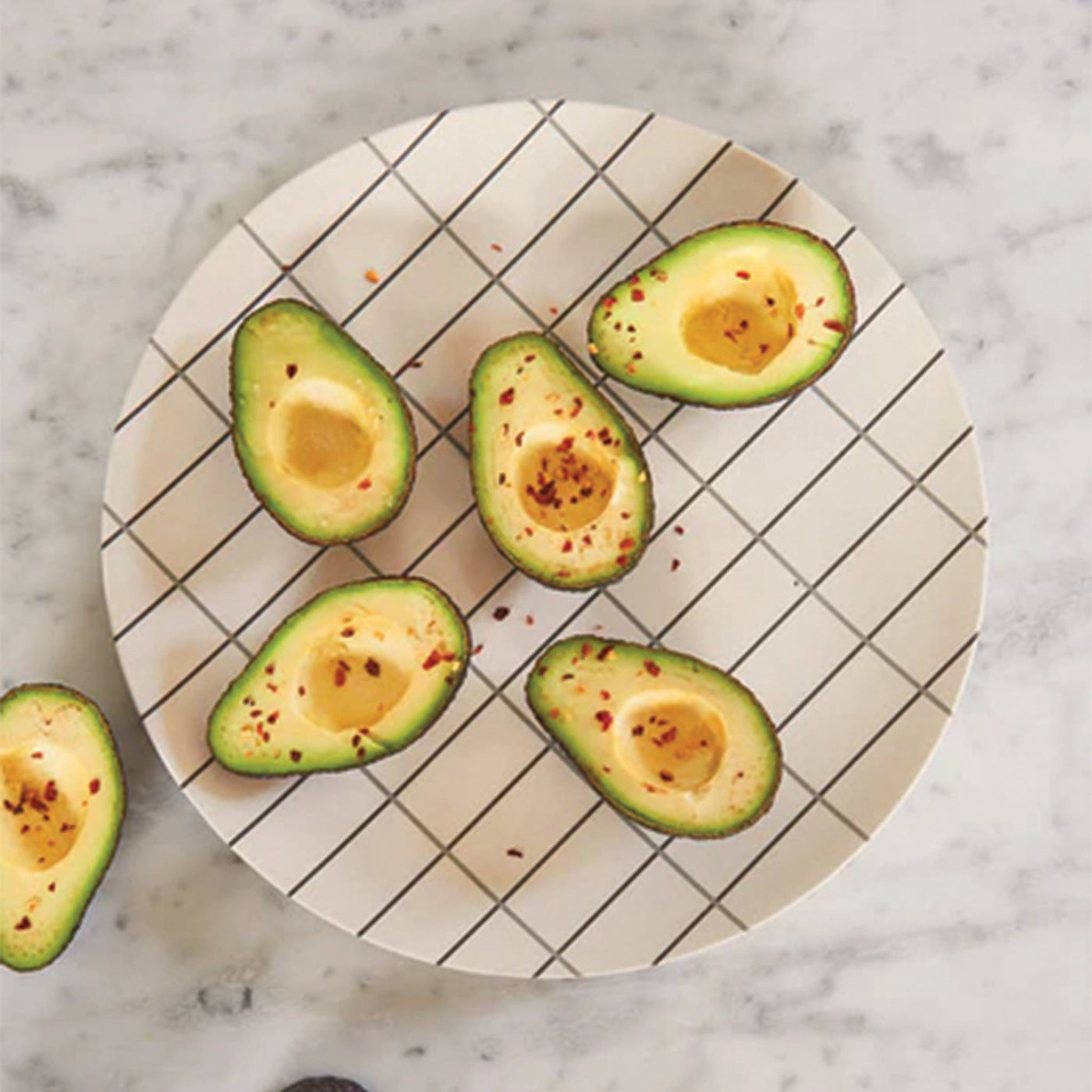 Bamboo Grid Tray holding avocados on the kitchen dining table