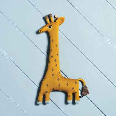 Giraffe made by Oyoy on a blue background