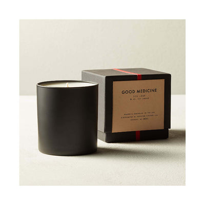 candle in black jar and black box
